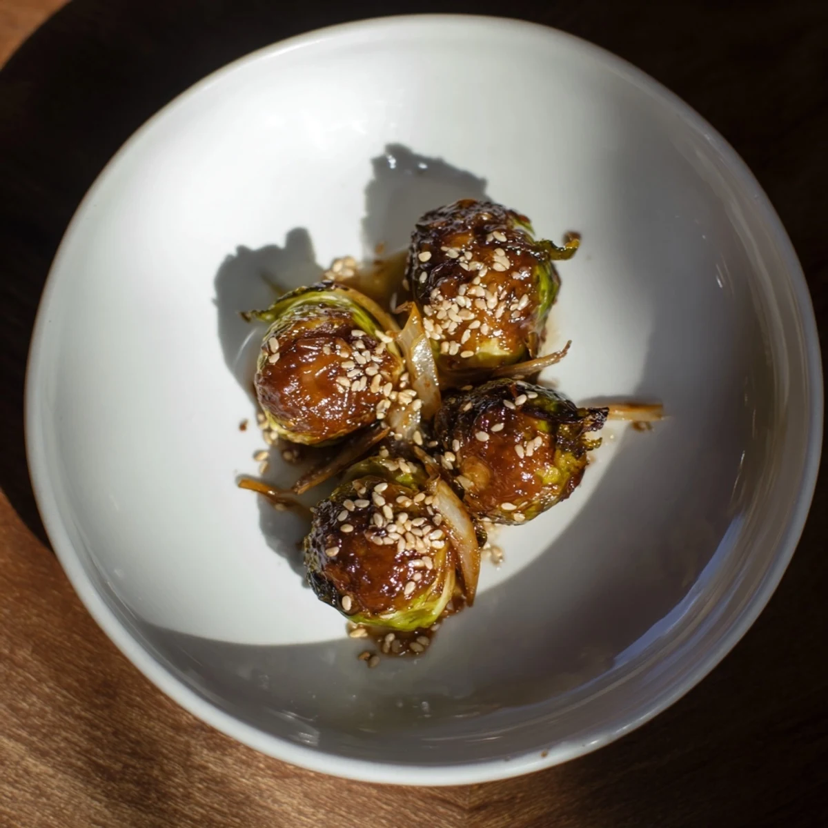 Golden-brown, crispy Honey-Soy Glazed Brussels Sprouts served on a platter, ready for a delicious side dish.
