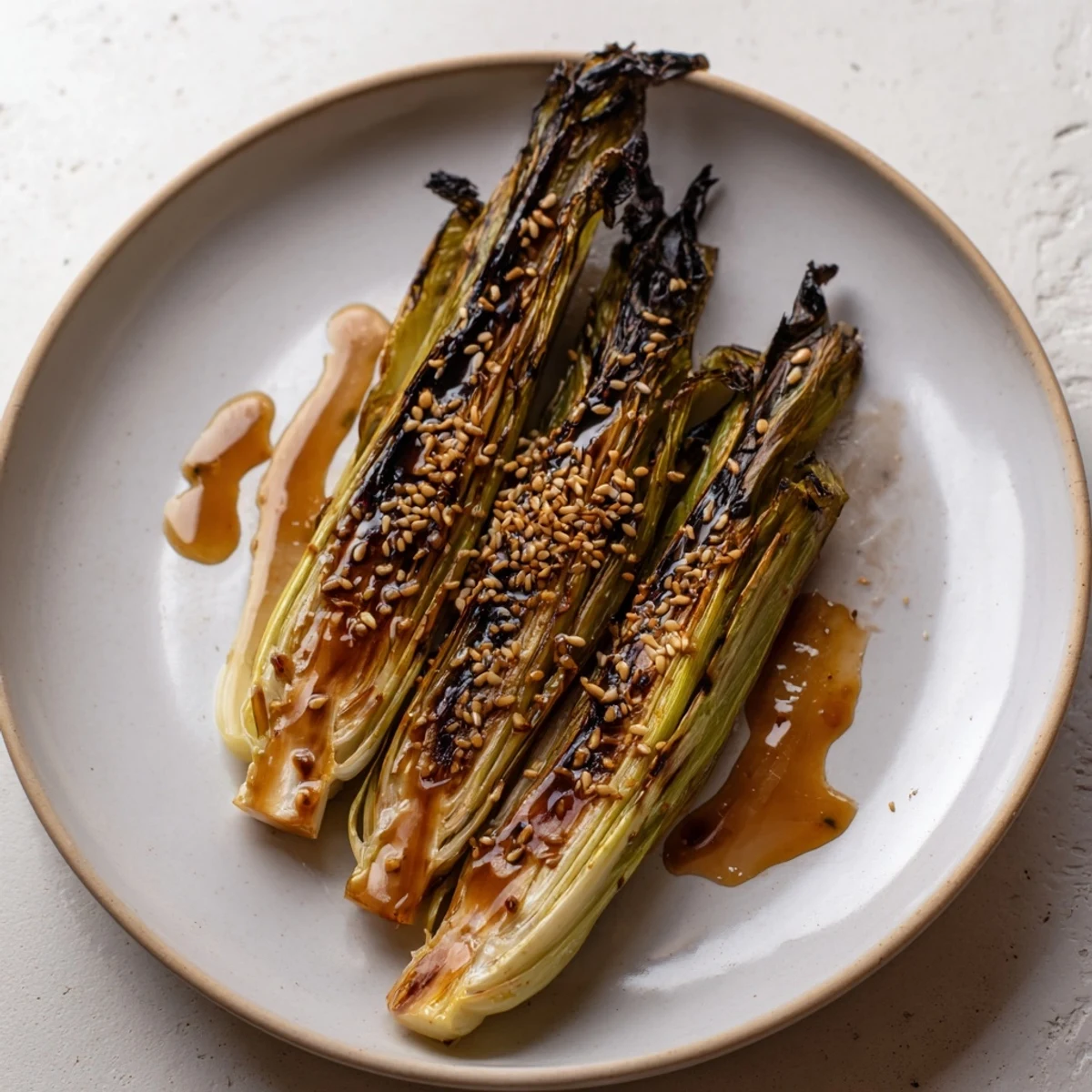 Savory and sweet Honey-Soy Glazed Brussels Sprouts, glistening with glaze and sesame seeds, perfect for dinner.