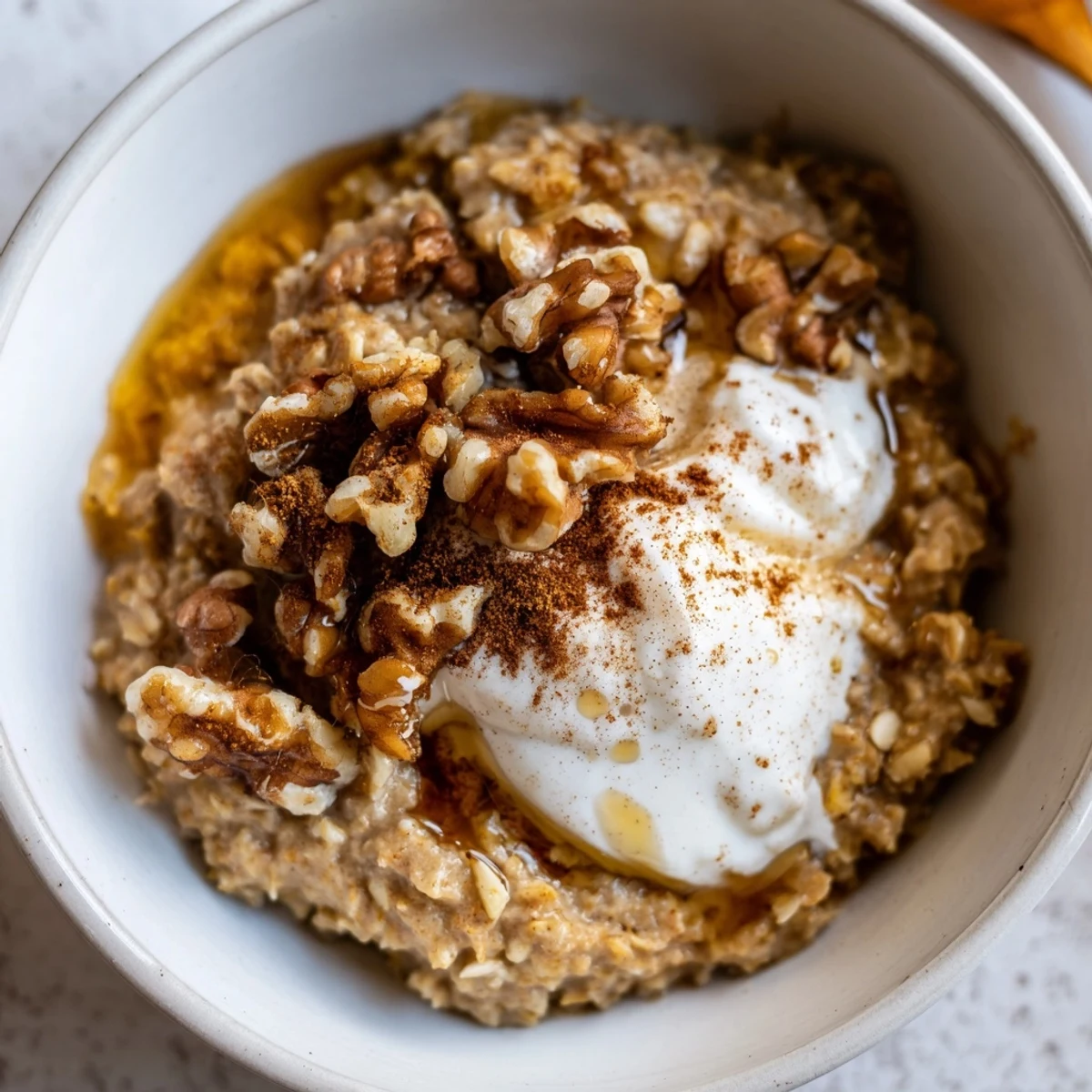 Warm, creamy Pumpkin Spice Latte Oats, perfect for a cozy fall breakfast, served in a bowl.