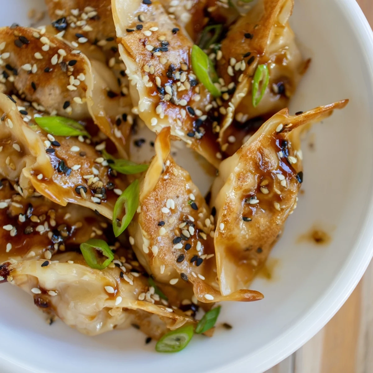 Enjoy the delicious crunch of Air Fryer Frozen Dumplings with a flavorful glaze, ideal for an appetizer.