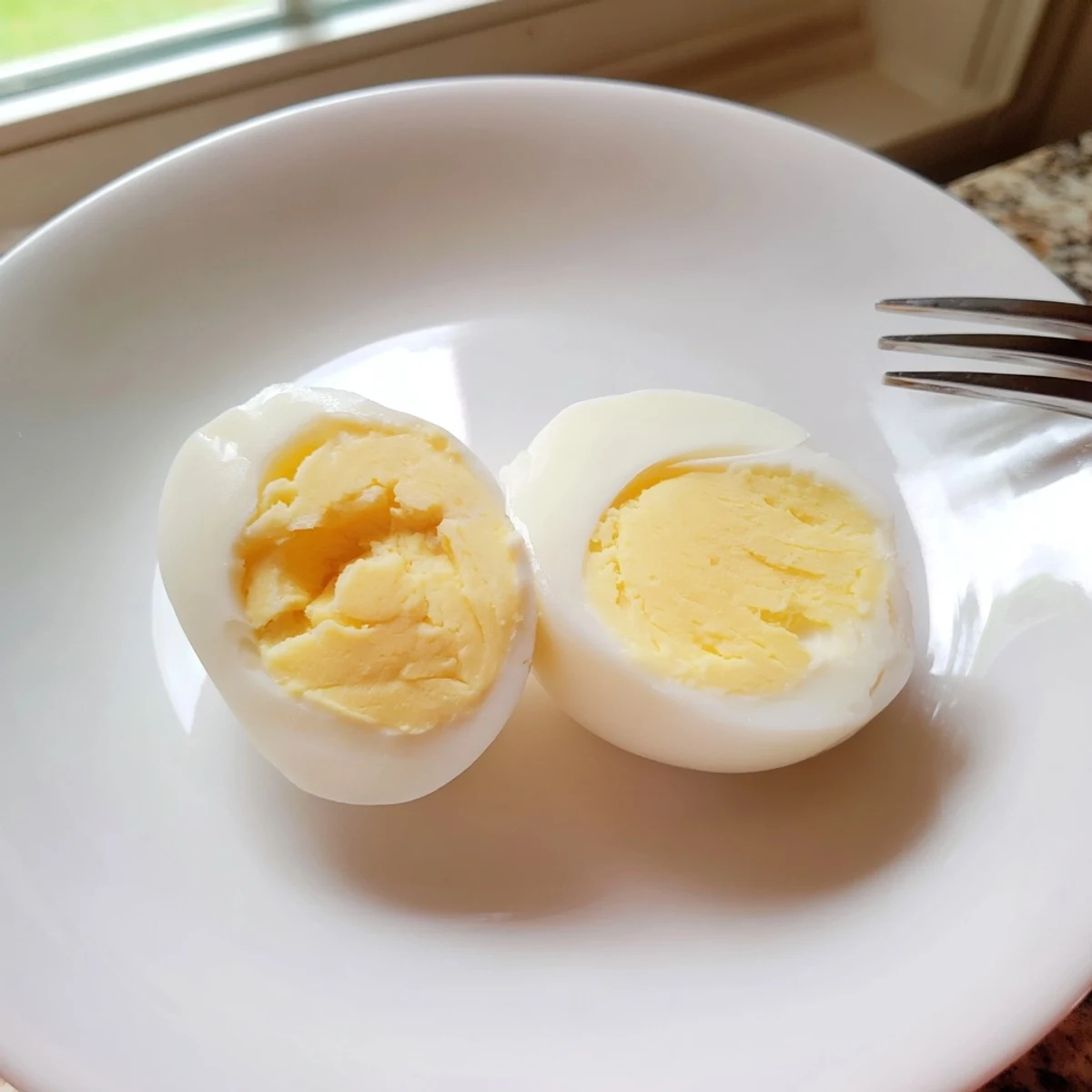 Up close: fresh air fryer boiled eggs ready to enjoy with a creamy yolk and perfect texture.