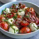 Mason Jar Caprese Salad with vibrant cherry tomatoes and mozzarella in a portable glass jar.  