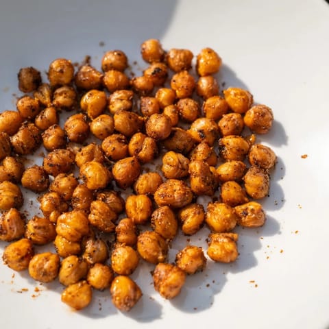Close-up of toasted crispy chickpea snack, showcasing the delicious spices and savory aroma ready to enjoy.