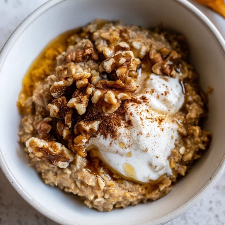 Warm, creamy Pumpkin Spice Latte Oats, perfect for a cozy fall breakfast, served in a bowl.