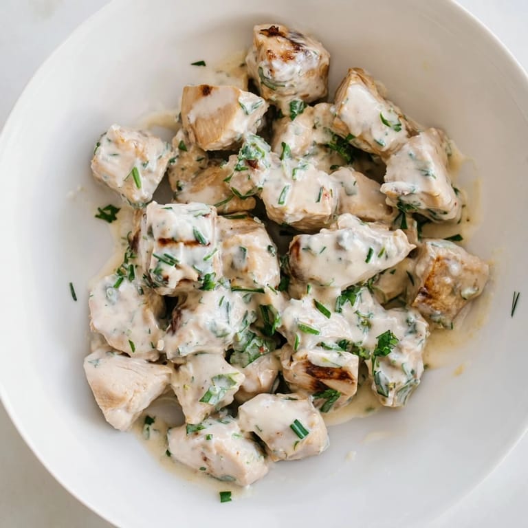 A hearty serving of Jalapeño Ranch Chicken Salad on a plate, featuring juicy chopped chicken, fresh veggies, and a drizzle of zesty ranch.